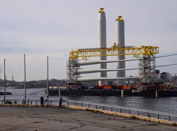 an image of a dock with a large structure in the ocean