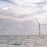 two wind turbines in the ocean
