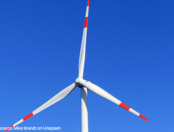 close up image of the top half of a wind turbine framing just the blades